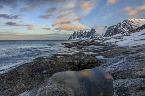 Rocky coast in front of Bergen, sea and pond, morning mood with clouds, winter, Tungeneset, Senja,