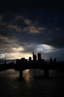 Dense clouds pass over the Frankfurt banking skyline in the evening, Floesserbruecke, Frankfurt am