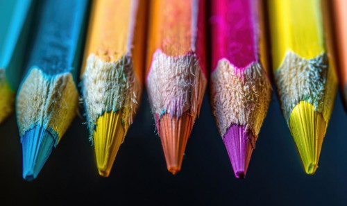Close-up of a bunch of colored pencils, abstract background with colored pencils macro view AI