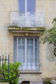 Window railings and balconies on residential buildings designed by Hector Guimard in the Art
