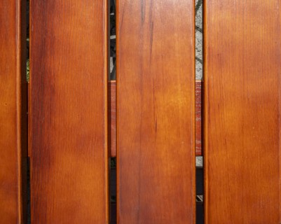 Wooden slats, seat of a traditional wooden folding chair in detail, background
