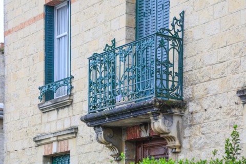 Window railings and balconies on residential buildings designed by Hector Guimard in the Art