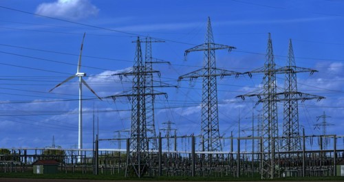 Wind turbine and high-voltage pylons at the Avacon substation in Helmstedt, Helmstedt, Lower