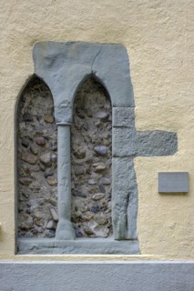 Gothic bifore window with Romanesque cube capital in the medieval hospital building in Lindau (Lake