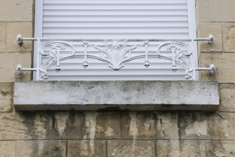 Window railings and balconies on residential buildings designed by Hector Guimard in the Art