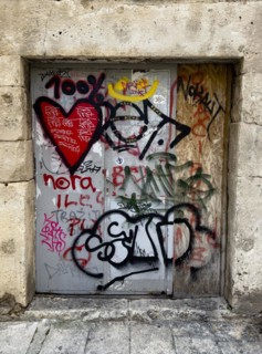 Heavy door full of graffiti and tags in an old city wall, Split, Dalmatia, Croatia, Europe