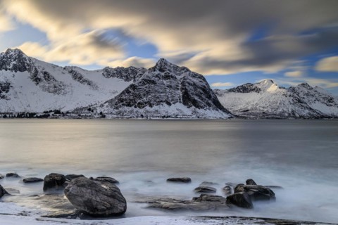 Rocky coast off Bergen, sea, waves, spray, morning mood with clouds, long exposure, winter,
