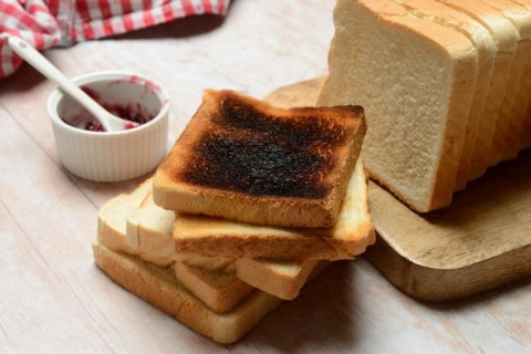 Burnt slice of toast with toast, toast