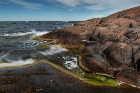 Red granite, rocky coast, surf, long exposure, Havsvidden, Geta, Aland, Aland Islands, Finland,