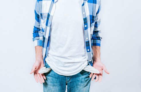 Person showing his empty pockets. Concept of financial problems