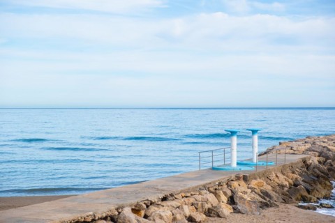 Showers on the beach in Sitges, Spain, Europe