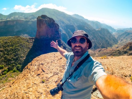 Selfie of a man at the Roque Palmes viewpoint near Roque Nublo in Gran Canaria, Canary Islands