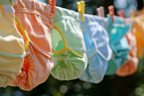 Eco friendly reusable cotton diapers on clothesline. KI generiert, generiert, AI generated