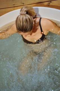 Top view of a woman relaxing in hot tub