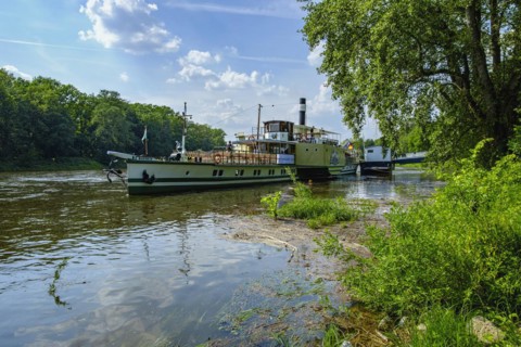 The historic paddle steamer KURORT RATHEN has docked at the steamer landing stage in Pillnitz,