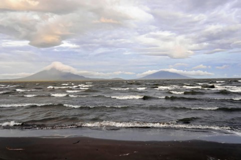 Underway near Rivas, Lake Nicaragua, Ometepe Island in the background, Nicaragua, Wave breaking on