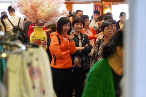 Chongqing, Chongqing Province, China, Cheerful crowd gathers on board a ship, some smiling at the
