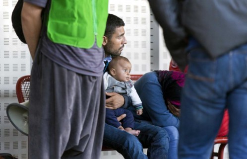 Syrian refugees have arrived at Schoenefeld station on a special train. They are then taken by bus