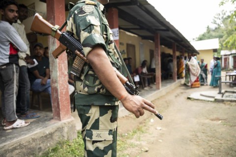 BOKAKHAT, INDIA, APRIL 19: A security personnel stands guard at a polling station during the first