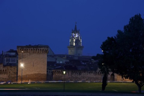 Old city wall and town hall tower at night, Avignon, Vaucluse, Provence-Alpes-Cote d'Azur, South of