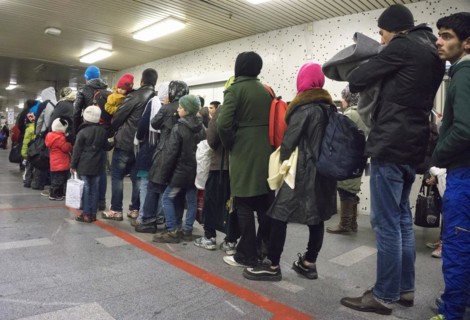 Refugees have arrived at Schoenefeld station on an IC train. They are then taken by bus to