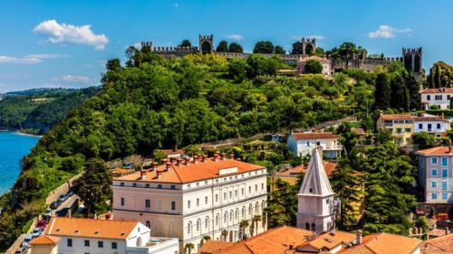 View from the bell tower over Piran with city walls and castle, harbour town of Piran on the