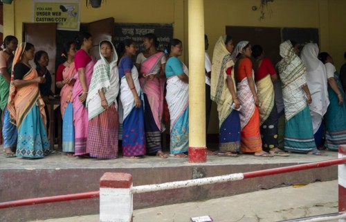 BOKAKHAT, INDIA, APRIL 19: Voters wait in line at a polling station to cast their votes during the