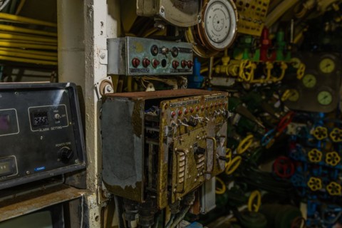 Old dilapidated gauges, dials and switch panels on board submarine on display at Unification Park