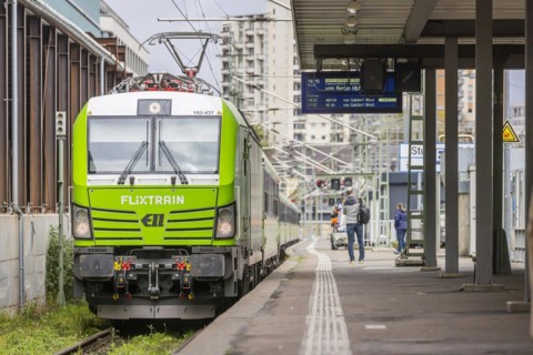 Flixtrain train at Stuttgart main station, track apron with arriving and departing trains,