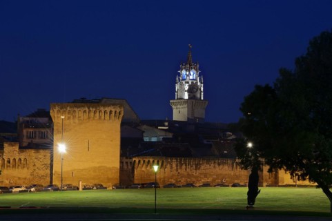 Old city wall and town hall tower at night, Avignon, Vaucluse, Provence-Alpes-Cote d'Azur, South of