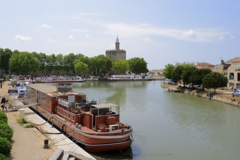 Ship in the harbour and Tour de Constance fortified defence tower, Aigues-Mortes, Camargue, Gard,