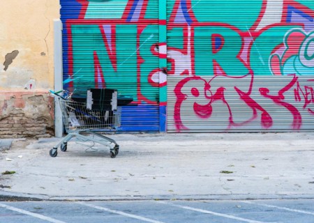 A shopping trolley full of metal and electronic scrap belonging to a scrap collector who sells it