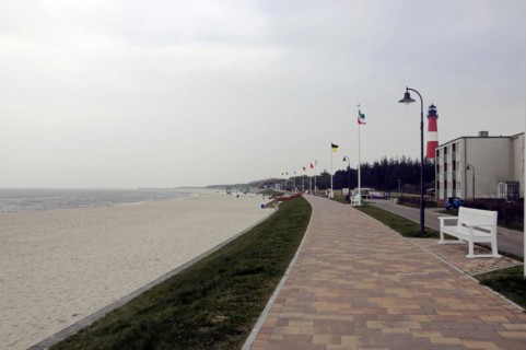 Sylt, North Frisian Island, Schleswig Holstein, Promenade along a sandy beach with flags and empty