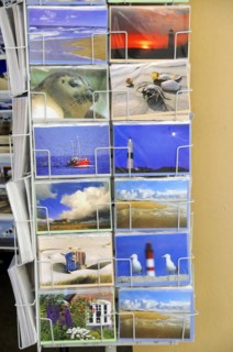Sylt, North Frisian Island, Schleswig-Holstein, A display with various colourful postcards with