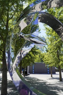 Beijing, China, Asia, Abstract shiny metal sculpture reflects the surroundings in a park, Asia