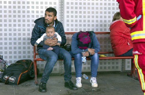 Syrian refugees have arrived at Schoenefeld station on a special train. They are then taken by bus