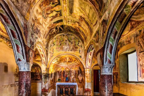 Centre apse with altar and Trinity as throne of grace, Gothic frescoes from 1490, a highlight of