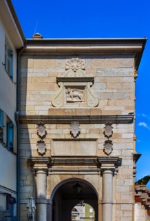 Old town alley with Venetian lion at the gate, harbour town Piran on the Adriatic coast with