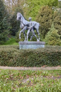 Bronze sculpture The Horse Steer by the sculptor Louis Tuaillon in the Wallanlagen Park in Bremen,