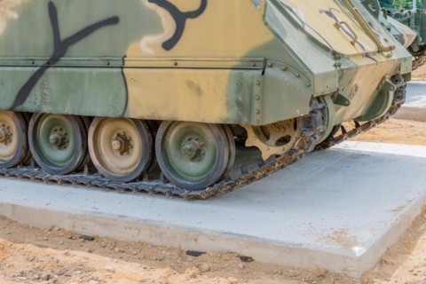 Tracks and lower portion of military vehicle used in Korean war on display in public park in
