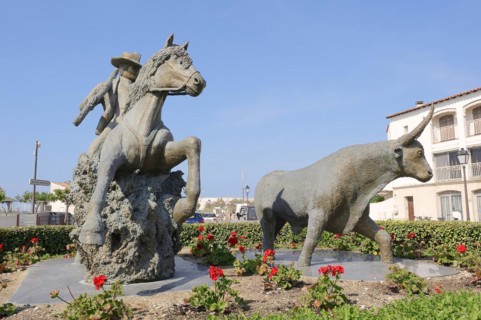 Statue of a drover with Camargue horse and Camargue bull, Les Saintes-Maries-de-la-Mer, Camargue,