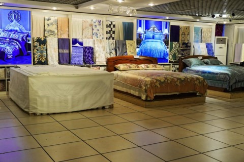 Silk Factory Shanghai, A bedroom exhibition with beds and colourful patterned bed linen, Shanghai,