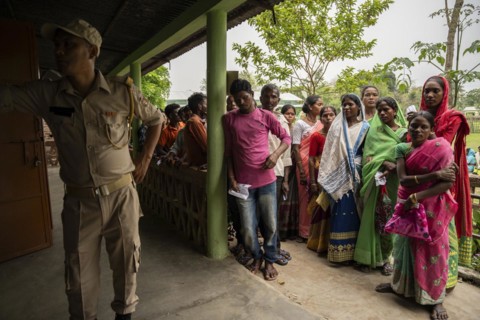 BOKAKHAT, INDIA, APRIL 19: Voters wait in line at a polling station to cast their votes during the