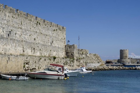 Boats anchoring in Kolona harbour in front of the city wall, Rhodes, Dodecanese archipelago, Greek