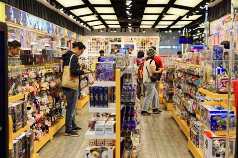 Stroll through Shanghai to the sights, Shanghai, China, Asia, people browse through a toy shop with