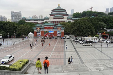 Chongqing, Chongqing Province, China, Asia, Another view of a busy city square with the city hall