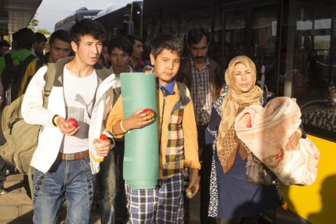 Syrian refugees have arrived at Schoenefeld station on a special train. They are then taken by bus