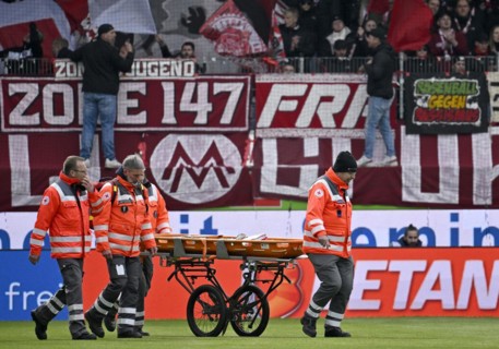 Injury, paramedic, Deurtsches Rotes Kreuz with mobile stretcher on the pitch, Voith Arena,
