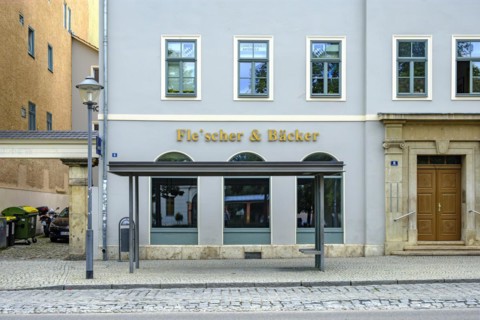 Butcher and baker in one, that's rare, exterior view of a house with the shop sign butcher &