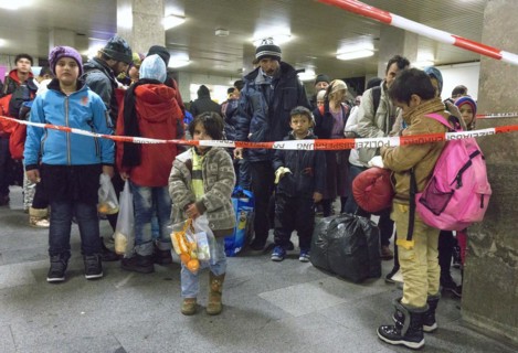 Refugees have arrived at Schoenefeld station on an IC train. They are then taken by bus to